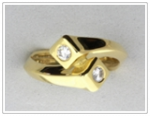 Double farrier nail cross-over ring with diamond set heads